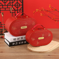 Boîte cadeau ovale gaufrée en carton rigide avec poignée en PU, style valise, pour emballage cadeau de mariage ou cadeau de demoiselle d'honneur