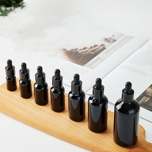 Flacon compte-gouttes d'huile essentielle en verre noir rond rechargeable de 5ml 10ml 15ml 30ml 50ml avec pipette en verre - Product Image 1