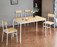 Vente directe usine : Ensemble table et chaises de salle à manger rectangulaire moderne et minimaliste en acier et bois, quatre places, avec espace de rangement compact