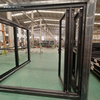 Porte pliante en aluminium moderne avec isolation thermique et double vitrage pour salon de villa