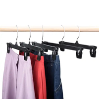 Cintres en plastique transparent noir pour adultes, pour jupes, jeans et pantalons, avec pinces, vente en gros