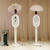 Machine Photobooth Ovale pour iPad, Kiosque Selfie DSLR avec Éclairage LED RGB et Flight Case pour Événements sur les Réseaux Sociaux
