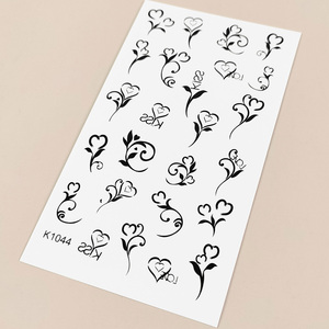Autocollants de <span class=keywords><strong>tatouage</strong></span> temporaires de luxe pour le corps, les <span class=keywords><strong>bras</strong></span>, le maquillage, imperméables, à motif de petite fleur noire en forme d'étoile de dessin animé, vente en gros OEM - Product Image 5