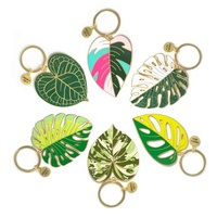 Vente en gros de porte-clés en émail à moule gratuit porte-clés en métal porte-clés creux en émail dur feuille plante