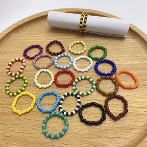 OUYE colorful cute Hand-woven rice bead elastic ring Girl color index finger ring hit colorful tiny beaded ring wholesale