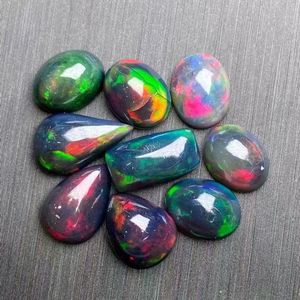 Cabujones sueltos de piedras preciosas ovaladas lisas de ópalo etíope negro natural a precio de fábrica al por mayor - Product Image 5