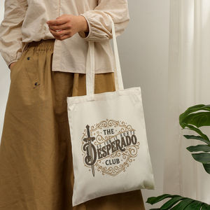Cadeaux promotionnels : Sac fourre-tout en toile imprimée The Desperado Club Fantasy Booktok, idéal pour un usage quotidien, le shopping et les voyages - Product Image 1