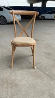 Chaises noires en fer à dossier croisé pour événements extérieurs, avec coussin, empilables et au design moderne, pour hôtels, fêtes et événements