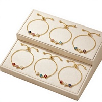 Nouveau bracelet de luxe haut de gamme incrusté de diamants, trèfle à quatre feuilles, pétales de fleurs, en acier inoxydable électroplaqué pour femme