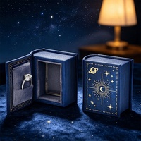Nouvelle boîte à bijoux vintage en forme de mini livre, en cuir PU éponge, imprimée quatre couleurs, estampée à chaud, pour rangement de bagues, pendentifs et montres motif ciel étoilé