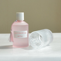 Hot Selling Striped Pink Glass Perfume Bottle 30ml 50 ml 100 ml Newest Design Luxury Round Perfume Bottle With Colorful Tassel