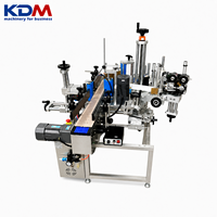 Machine d'étiquetage de bouteilles rondes en ligne à grande vitesse KDM-AL150C pour les lignes de boissons, de vin et d'eau