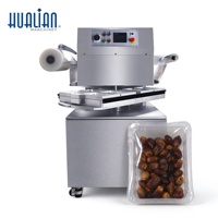 Machine d'emballage sous vide rotative continue Hualian HVT-450R pour aliments secs avec remplissage de gaz pour dattes et noix