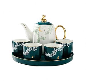 Juego de Tazas de Té de Cerámica con Diseño Rústico Rural de Hojas Verdes y Luna, 4 Tazas y 1 Tetera - Product Image 1