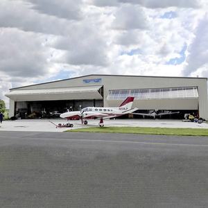 Лидер продаж, электрические двухскладные подъемные двери для самолетов, вертикальные двухскладные гаражные двери, сверхпрочные складные гаражные двери - Product Image 4