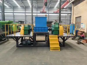 آلة تمزيق المعادن الصناعية آلة تمزيق نفايات البناء بمحور مزدوج لنفايات البناء آلة تمزيق المعادن آلة إعادة تدوير النفايات