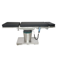 Table chirurgicale électrique ultra-basse avec base en acier inoxydable 304, barrières latérales mates, ressorts pneumatiques allemands et coussin antistatique durable