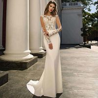 Robe de mariée sirène à manches longues en dentelle, corsage ajusté, appliques florales illusion, traîne balayante, blanc ivoire