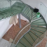 Bande dessinée en acier et carbone, caisse d'escalier ronde, d'intérieur en verre, incurvée, en spirale, 10 m