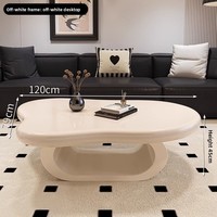 Table basse italienne minimaliste en forme de nuage : design moderne, créatif et luxueux de couleur crème pour le salon