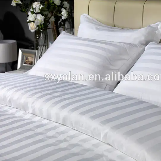 Acolchado blanco tela de hotel cama láminas uso
