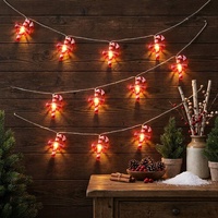 Guirlande lumineuse LED blanc chaud avec ornement en forme de nœud rouge et canne à sucre, câble transparent, fonctionne à piles, pour décoration de Noël