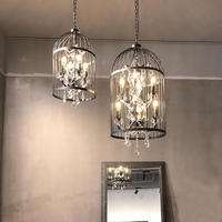 Lustre moderne en fer noir avec cage à oiseaux et cristaux transparents, design rustique américain pour restaurant et salon