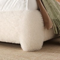 Lit rembourré en tissu bouclé crème avec large tête de lit ronde, cadre en tissu rembourré et pied de lit à profil bas pour maison moderne