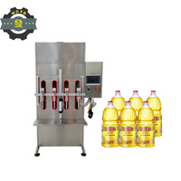 Machine de remplissage industrielle à quatre têtes de 5 litres pour l'alcool, les spiritueux, la sauce soja, le vinaigre, l'huile en bouteilles pour les applications de boissons