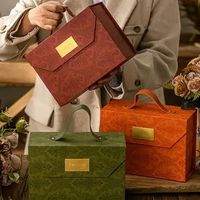 Vente en gros d'emballages cadeaux romantiques, boîte cadeau pliable de luxe pour ensemble de bougies avec poignée