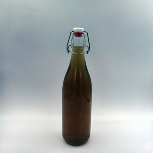 Bouteille en verre transparente ronde de 750 ml, 450 g, avec bouchon à bascule en métal, élégante, prix compétitif, fournisseur d'usine - Product Image 1