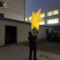 Marionnette gonflable lumineuse en forme d'étoile pour les activités commerciales, les fêtes, les défilés