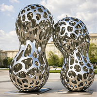 Grande sculpture abstraite creuse en forme d'arachide en acier inoxydable, décoration artistique en métal pour l'aménagement extérieur, statue pour place publique, hôtel, jardin