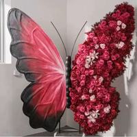 Toile de fond en fer en forme de papillon avec fleurs artificielles et design détachable pour scènes d'événements professionnels et cabines photo