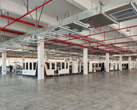 Machine à coudre à plat haute efficacité 4 côtés, fonctionnement à un bouton pour l'usine de textiles domestiques