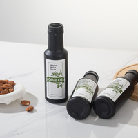 Bouteilles en verre rondes de 100ml bouteilles d'huile d'argan d'huile d'olive noire mate avec impression personnalisée bouteille d'huile de cuisson rechargeable avec verseur