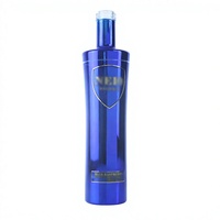 Bouteille à spiritueux en verre bleu élégant de 750 ml, avec bouchon en liège, pour vodka de qualité supérieure, Shandong JB GLASS