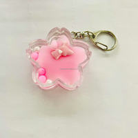 OEM ODM Nouveau Vente en gros Personnalisé Créatif Mini Fleur de Sakura en Acrylique Porte-clés Flottant 3D Dessin animé Liquide Quicksand Paillettes Alliage