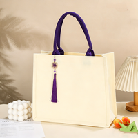 Sac fourre-tout en toile laminée personnalisé avec pompon nœud chinois, grande capacité, idéal pour les cadeaux promotionnels universitaires et d'entreprise