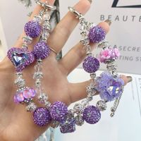 Breloque de téléphone 2026 au design varié, de haute qualité, faite à la main, pendentif de sac perlé, porte-clés tendance de luxe avec strass pour femme