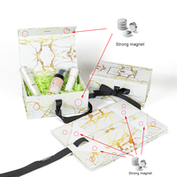 Boîte cadeau pliable magnétique haut de gamme en carton écologique avec design marbré gaufré personnalisé, finition mate et doublure en éponge pour