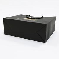 Sac en papier de luxe personnalisé avec logo, noir mat, en carton, avec poignées en corde de coton enduite d'or, vente en gros
