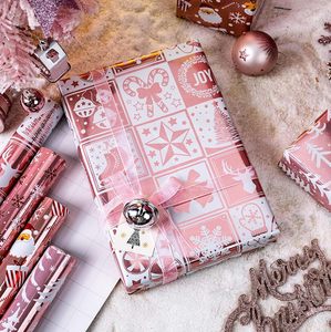 Papel de Regalo Navideño con Diseño de Copos de Nieve Rosas, Árboles de Navidad, Campanas, Dulces y Estrellas - Product Image 2