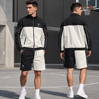 Conjunto Deportivo de Dos Piezas para Hombre con Bloques de Color en Contraste, Chaqueta con Cremallera y Cuello Alto, Pantalones Cortos, Bolsillos Inclinados, Diseño Asimétrico