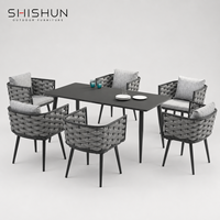 Ensemble de table et chaises de salle à manger d'extérieur en tissu imperméable tissé à la main en alliage d'aluminium moderne pour patio, villa, hôtel et salon