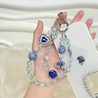 Nueva funda para teléfono con correa de pulsera de lentejuelas metálicas con efecto de diamante y cadena colgante