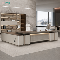 Ensemble de bureau exécutif LIYU en forme de L avec bibliothèque murale, rangement latéral, chaise à dossier haut, mobilier de bureau en bois avec éclairage LED et design cannelé