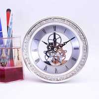 Horloge de bureau squelette de luxe argentée avec lunette en strass, en plastique transparent, à piles, mouvement à quartz, chiffres romains, pour la maison