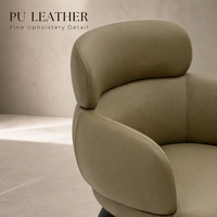 Fauteuil lounge Vivian en cuir PU avec structure en contreplaqué courbé, coussin en éponge et base pivotante pour salon