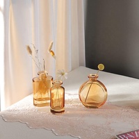 Vase petite bouteille de couleur ambre de luxe centres de table vase bourgeon en verre moderne ensemble de 3 vase à fleurs décor de table de bureau de mariage à domicile